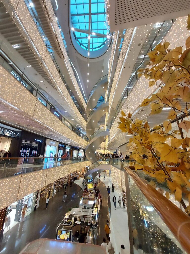 rare digest why more locals and expats are choosing to live in bgc photo of bonifacio global city sm aura premier interior and ceiling skylight