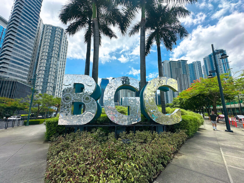 rare digest why more locals and expats are choosing to live in bgc big shiny bgc sign mckinley parkway entrance