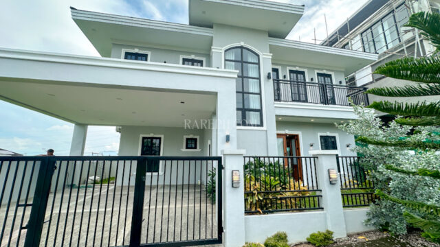 chateaux de paris house for sale facade with 2 car garage
