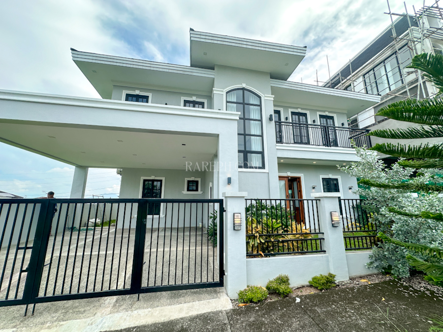 chateaux de paris house for sale facade with 2 car garage